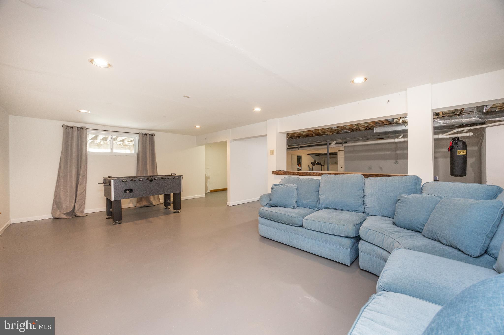 10 Brampton Road Malvern, PA 19355 - Photo 37 of 49 a living room with furniture and a flat screen tv