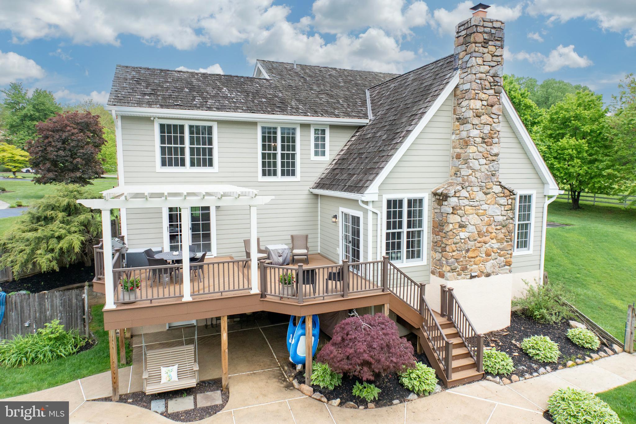 10 Brampton Road Malvern, PA 19355 - Photo 43 of 49 a front view of house with a garden and patio
