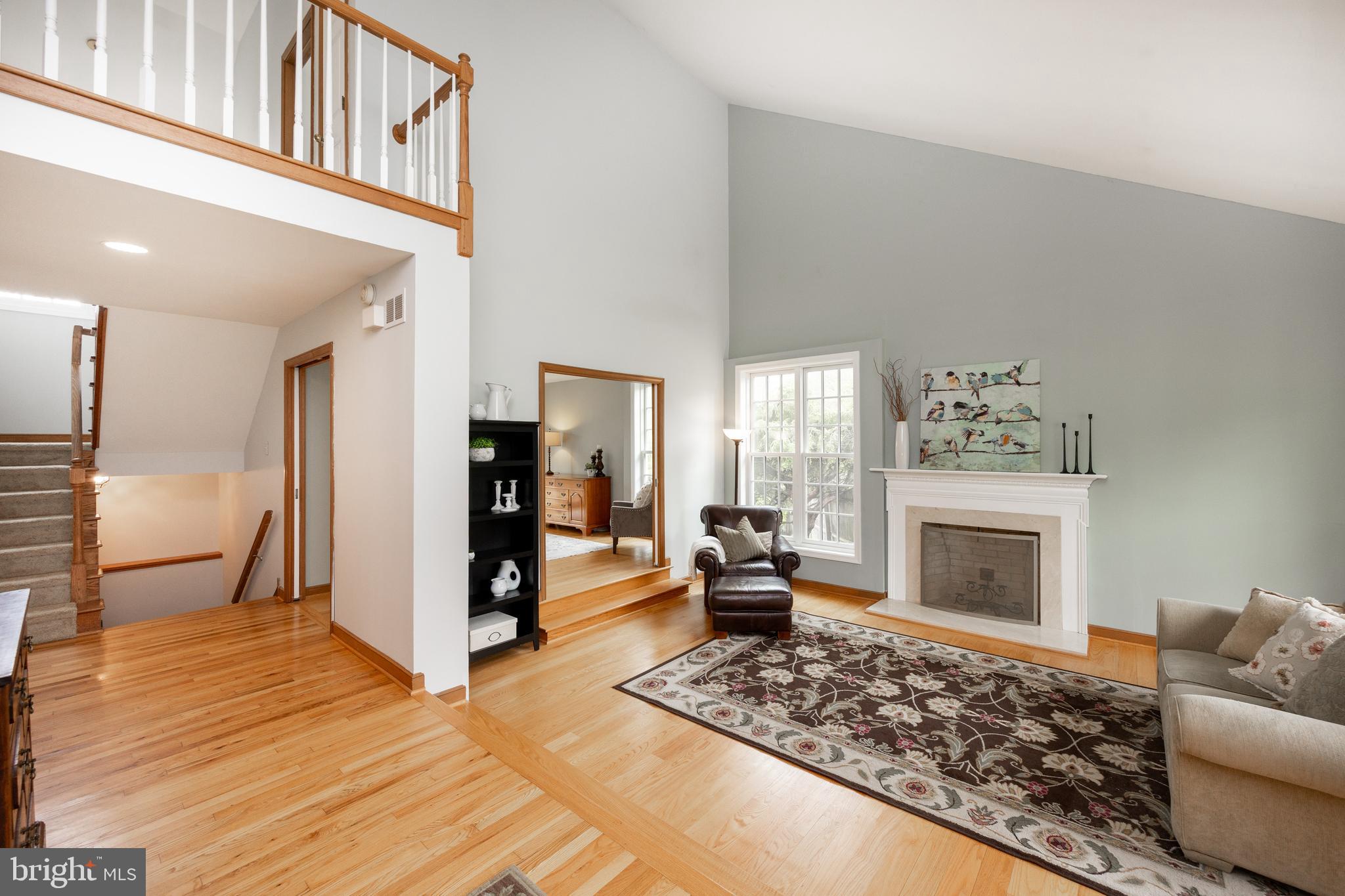 10 Brampton Road Malvern, PA 19355 - Photo 9 of 49 a living room with furniture and a fireplace
