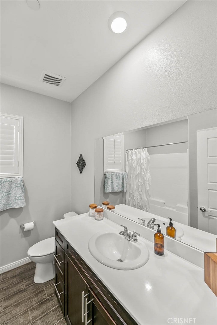 19663 Griffith Drive Saugus, CA 91350 - Photo 13 of 28 a bathroom with a sink toilet and mirror