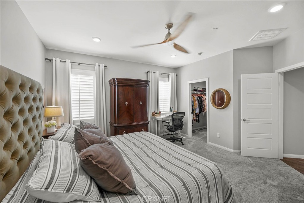 19663 Griffith Drive Saugus, CA 91350 - Photo 14 of 28 a bedroom with a bed and a chair