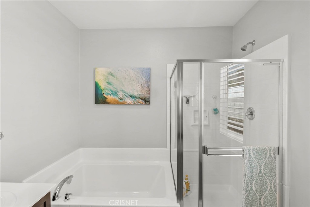 19663 Griffith Drive Saugus, CA 91350 - Photo 17 of 28 a bathroom with a bathtub and a shower
