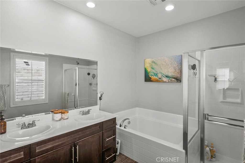 19663 Griffith Drive Saugus, CA 91350 - Photo 18 of 28 a bathroom with a tub sink and mirror