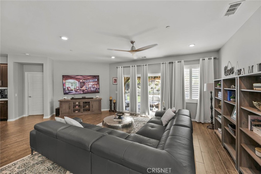 19663 Griffith Drive Saugus, CA 91350 - Photo 4 of 28 a living room with furniture a rug and a bookshelf