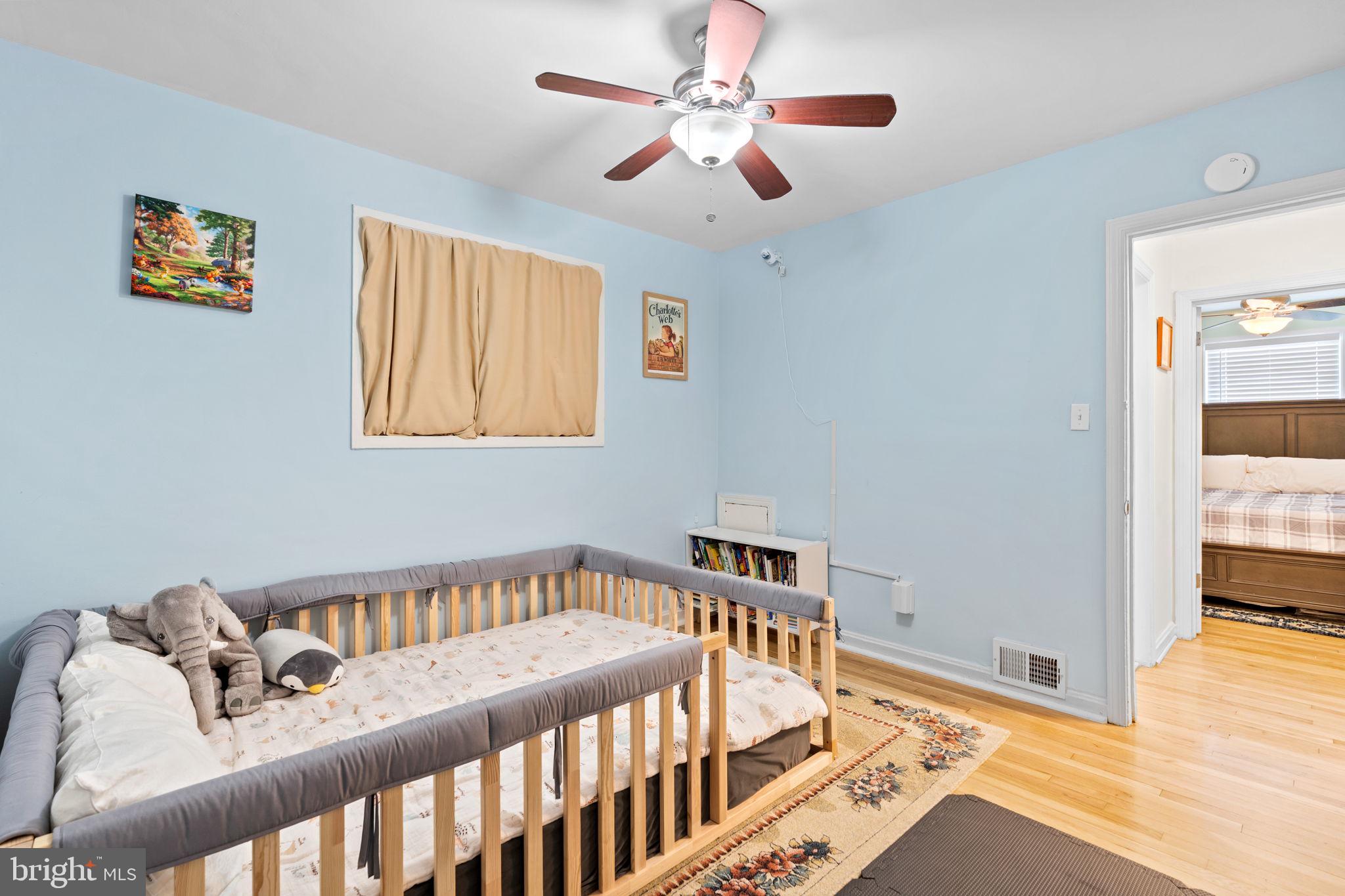 10310 Brunswick Avenue Silver Spring, MD 20902 - Photo 21 of 43 Charming blue nursery with cozy vibes.
