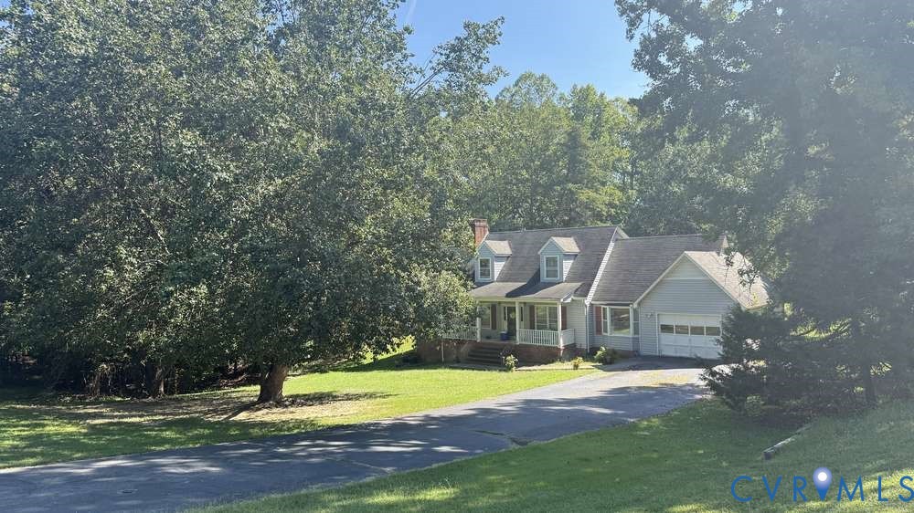 320 Wilson Road Danville, VA 24541 - Photo 3 of 17 Light blue siding with white trim, a covered front