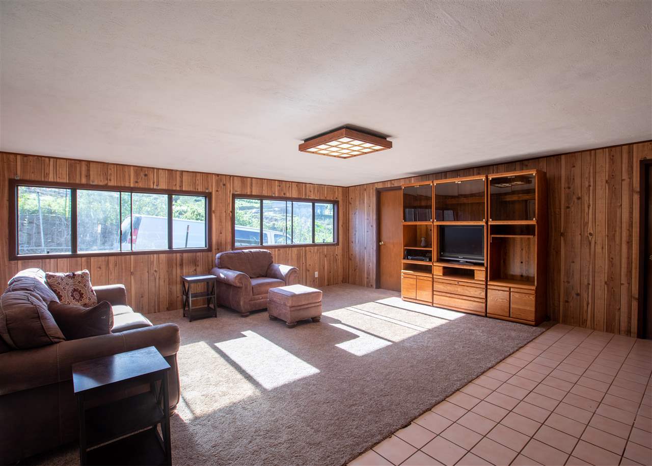 586 Naalae Road Kula, HI 96790 - Photo 12 of 30 a living room with furniture and a large window