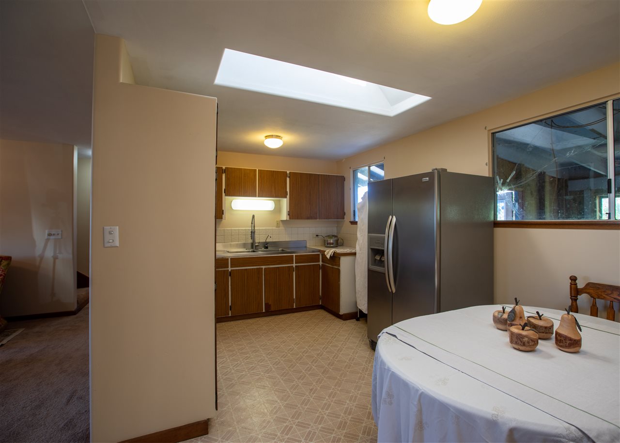 586 Naalae Road Kula, HI 96790 - Photo 14 of 30 a kitchen that has a refrigerator and a sink