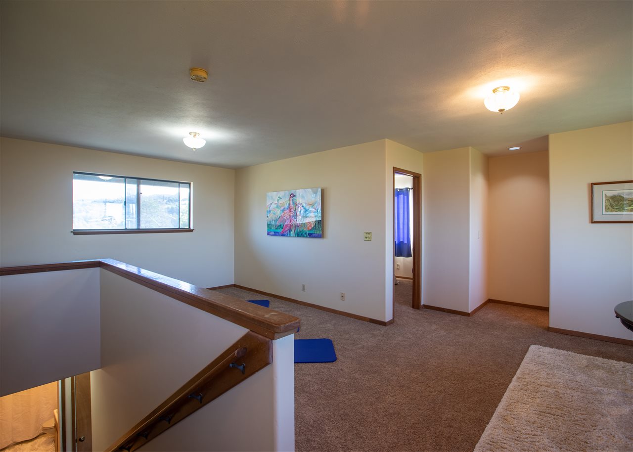 586 Naalae Road Kula, HI 96790 - Photo 18 of 30 a view of livingroom with hardwood and hallway