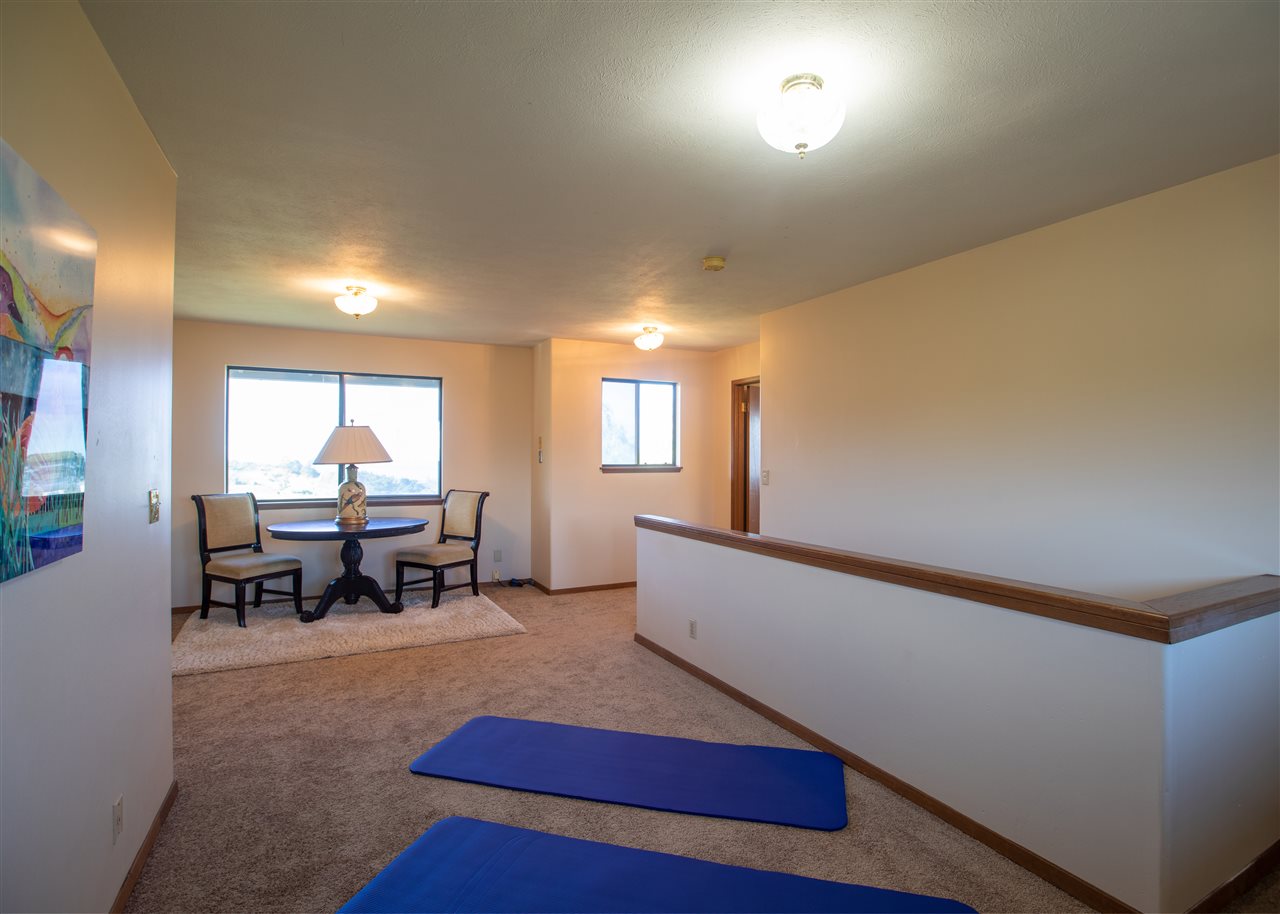 586 Naalae Road Kula, HI 96790 - Photo 24 of 30 a living room with furniture and a table