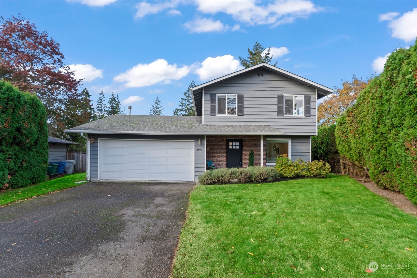 207 Elma Place Southeast Renton, WA 98059 - Photo 1 of 35 a front view of house with yard and green space