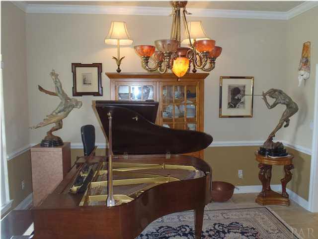 7833 Petersen Point Road Milton, FL 32583 - Photo 3 of 24 Large den easily accomadates a baby grand