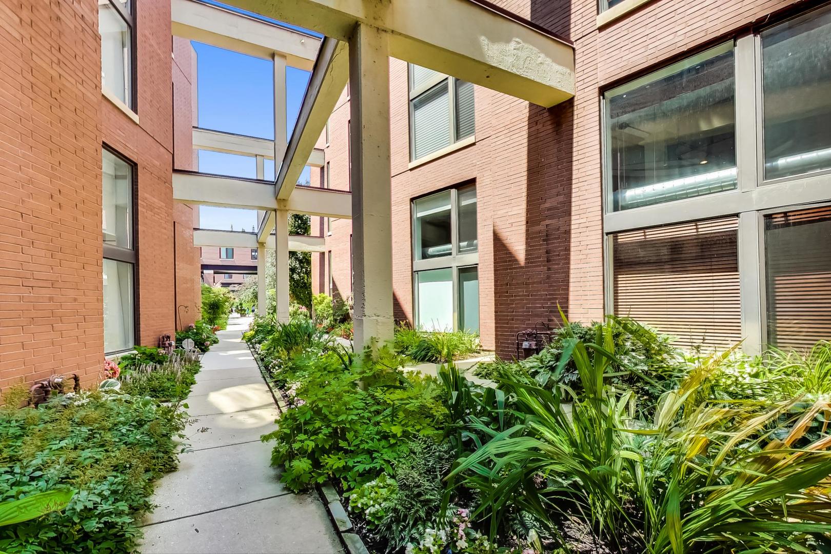 222 South Racine Avenue, Unit 203 Chicago, IL 60607 - Photo 3 of 20 a view of a pathway along with potted plants