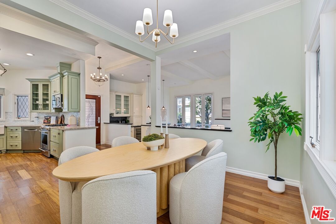 20 Ketch Street, Unit 1 Marina del Rey, CA 90292 - Photo 11 of 39 a view of a dining room with furniture and a potted plant