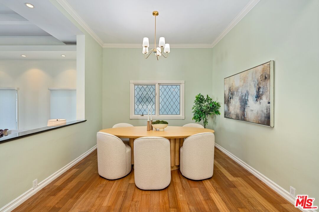 20 Ketch Street, Unit 1 Marina del Rey, CA 90292 - Photo 12 of 39 a dining room with table chairs and wooden floor