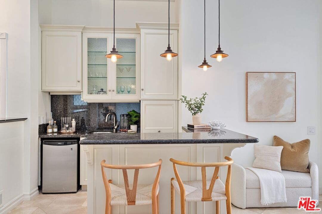 20 Ketch Street, Unit 1 Marina del Rey, CA 90292 - Photo 5 of 39 a kitchen with stainless steel appliances granite countertop a white cabinets and a refrigerator