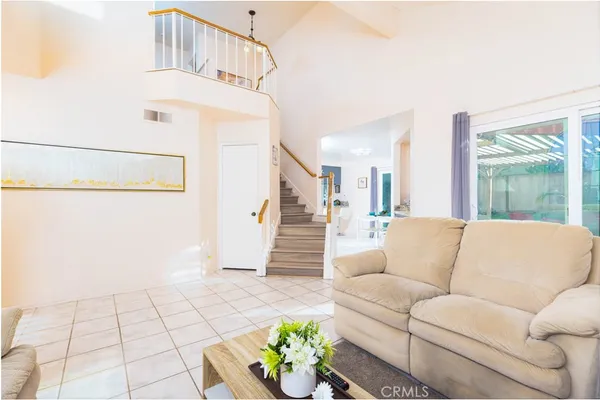 a living room with furniture and a rug
