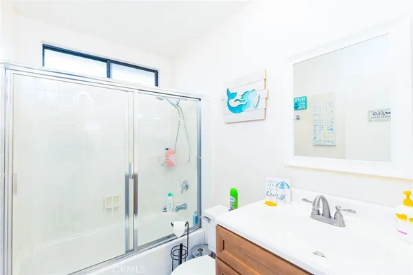 a bathroom with a sink and a shower