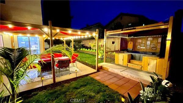 a outdoor space with patio lots of furniture and chandelier