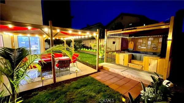 a view of a chairs and table in patio