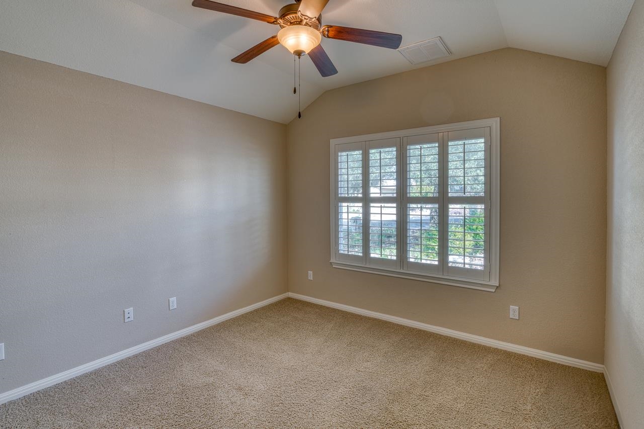 1403 Adam Burnet, TX 78611 - Photo 21 of 30 an empty room with a window and a fan