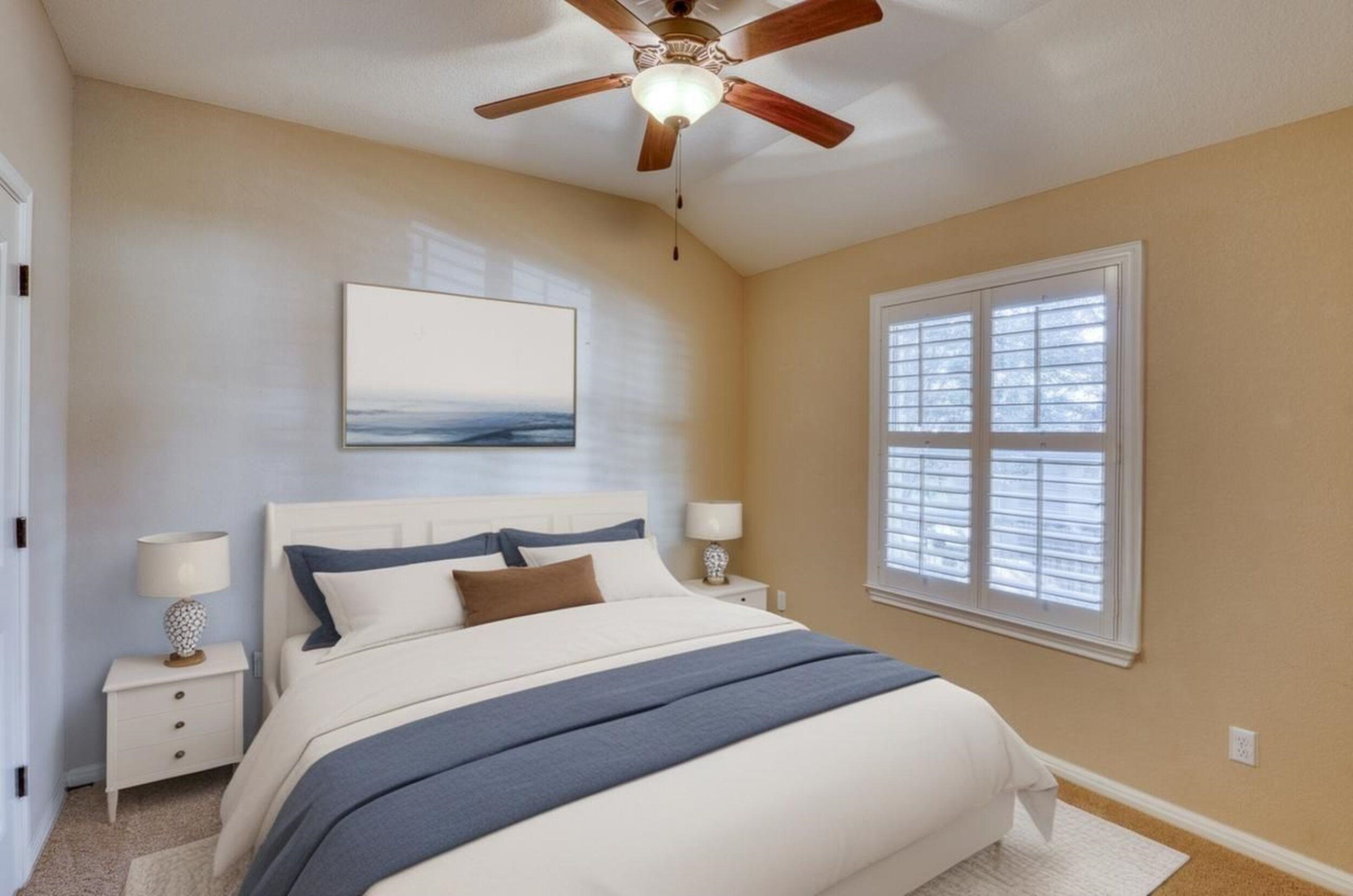 1403 Adam Burnet, TX 78611 - Photo 24 of 30 a bedroom with a bed and a chandelier