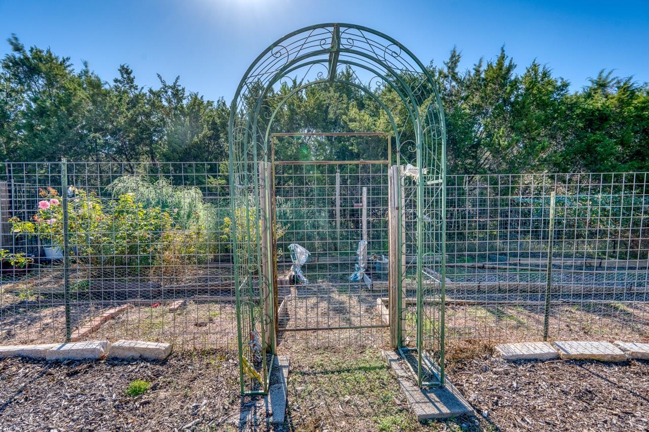 1403 Adam Burnet, TX 78611 - Photo 28 of 30 a backyard of a house with lots of green space
