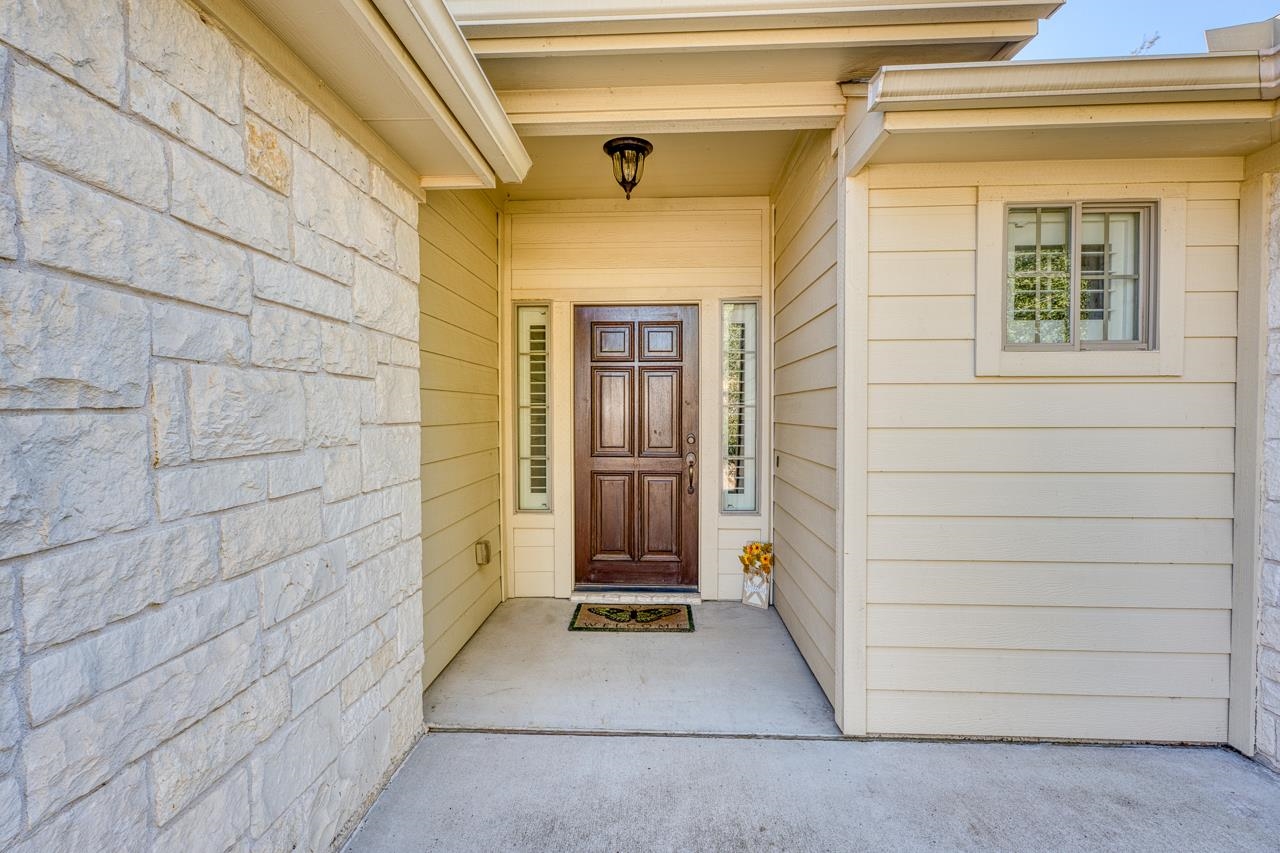 1403 Adam Burnet, TX 78611 - Photo 3 of 30 a view of entrance door of the house