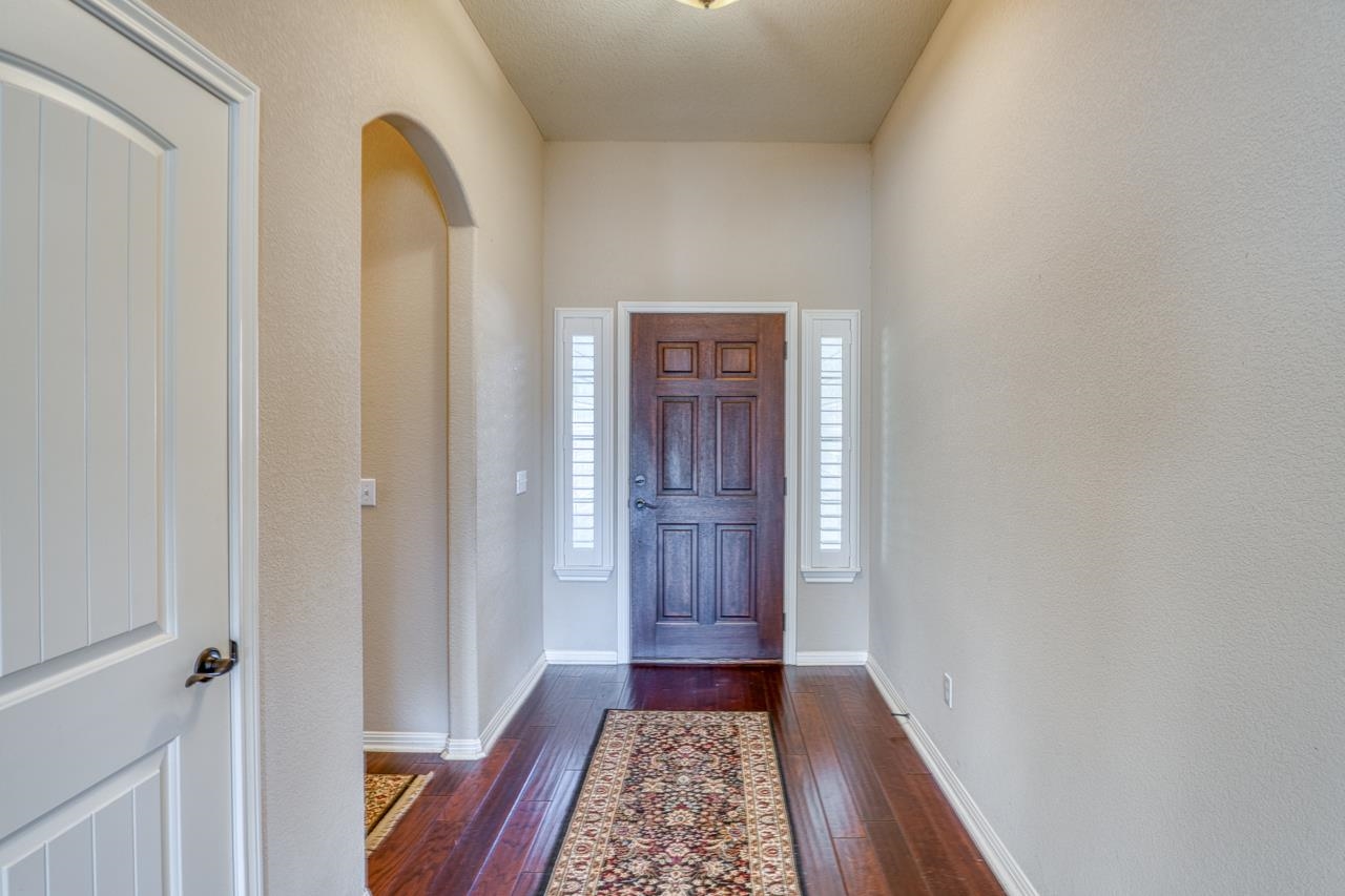 1403 Adam Burnet, TX 78611 - Photo 4 of 30 a view of hallway with wooden floor
