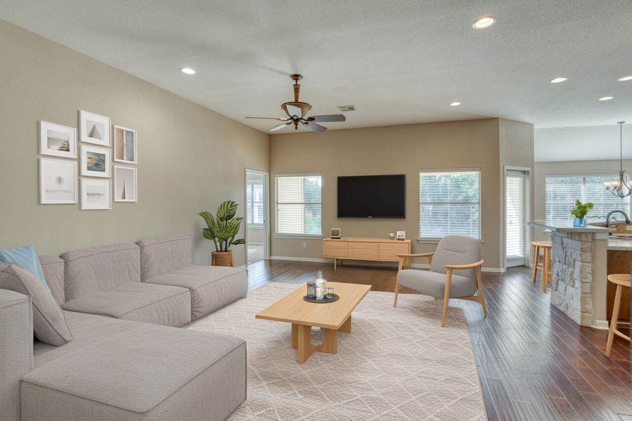 1403 Adam Burnet, TX 78611 - Photo 7 of 30 a living room with furniture and a flat screen tv