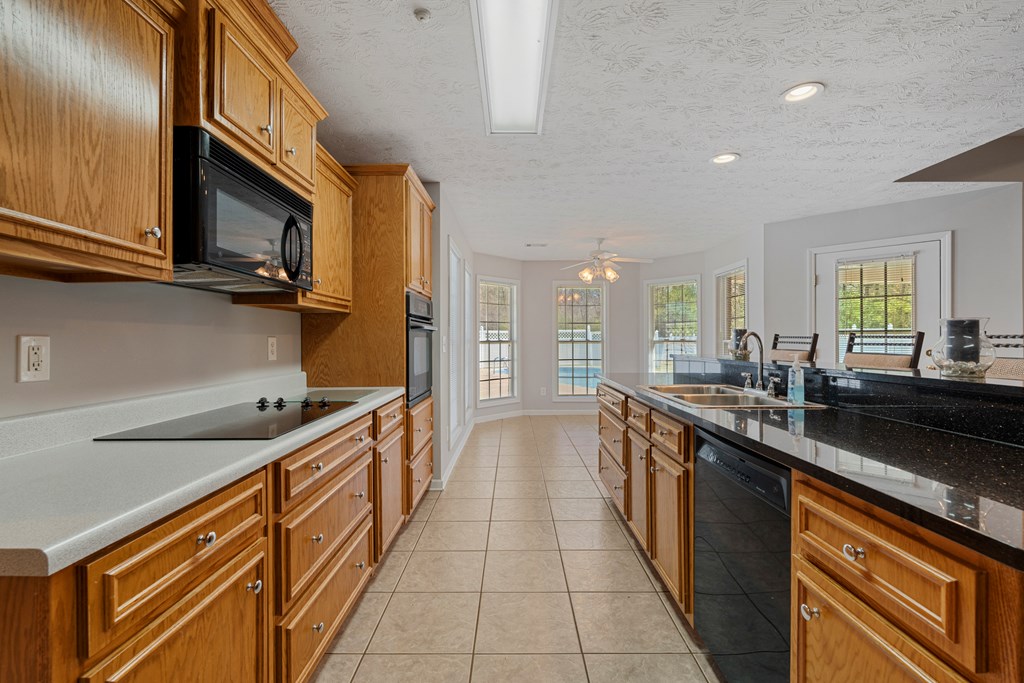2034 Lee Road Salem, AL 36874 - Photo 11 of 47 a kitchen with stainless steel appliances a sink and a stove