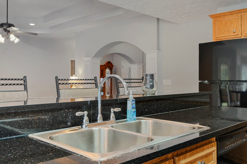 2034 Lee Road Salem, AL 36874 - Photo 13 of 47 a kitchen with granite countertop a sink and a stove top oven