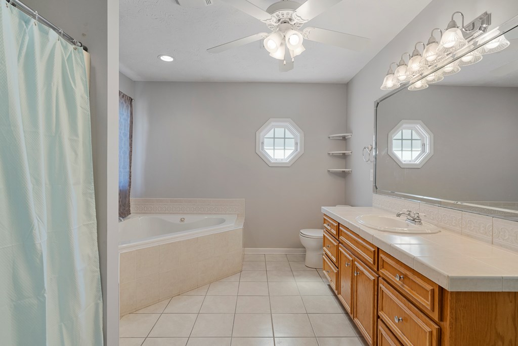 2034 Lee Road Salem, AL 36874 - Photo 19 of 47 a bathroom with a sink a toilet and a bathtub