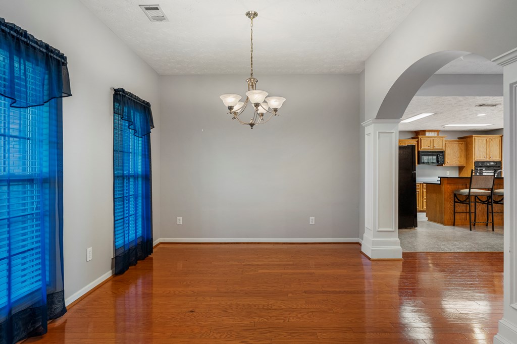 2034 Lee Road Salem, AL 36874 - Photo 3 of 47 a view of a room with wooden floor staircase and a kitchen