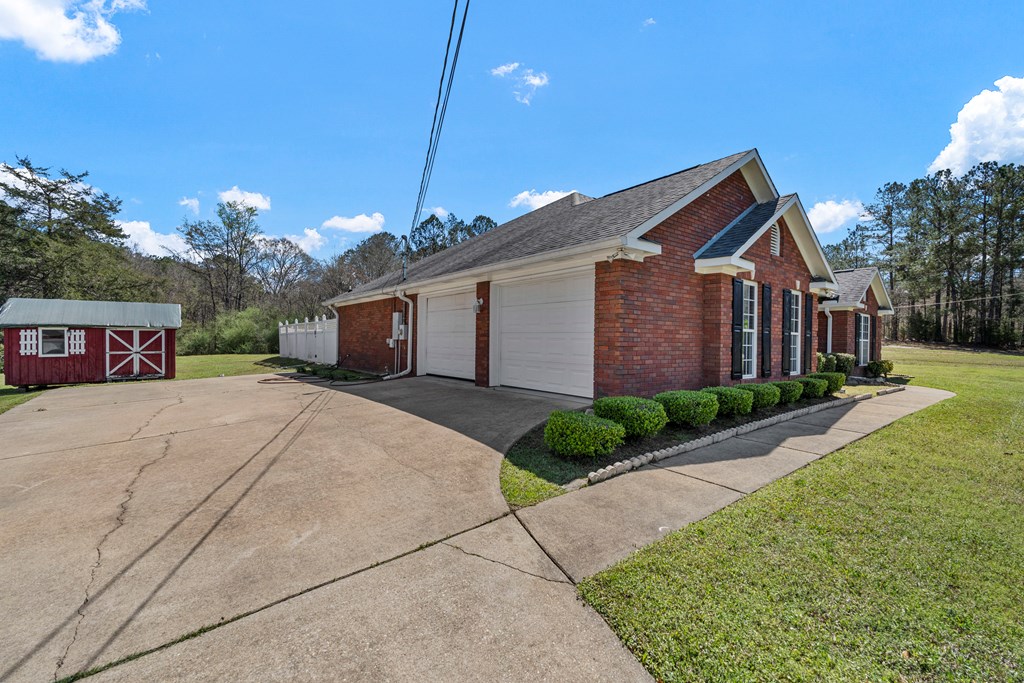 2034 Lee Road Salem, AL 36874 - Photo 31 of 47 a front view of a house with a yard and a garage