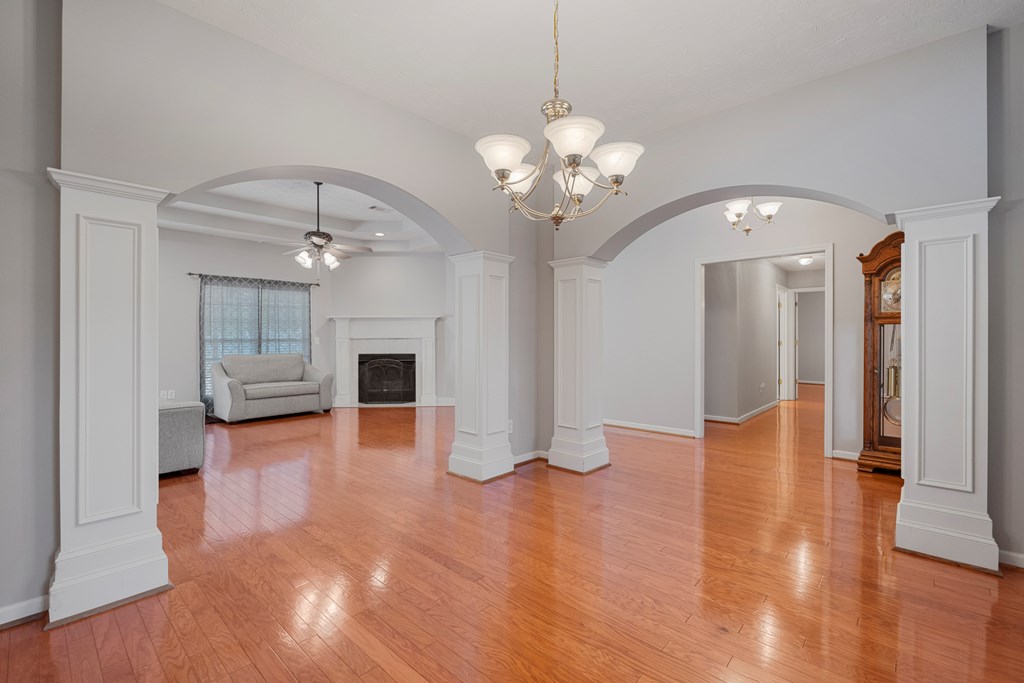 2034 Lee Road Salem, AL 36874 - Photo 6 of 47 a view of a livingroom with wooden floor and a kitchen space