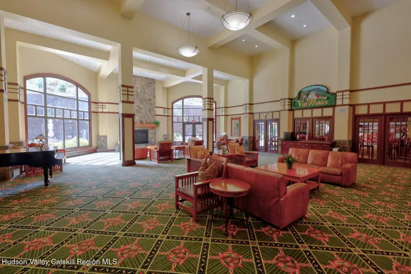 a lobby with furniture and rug