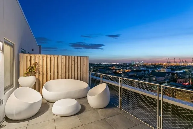 a balcony with chairs