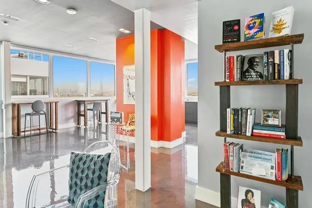 a very nice looking living room with a large window