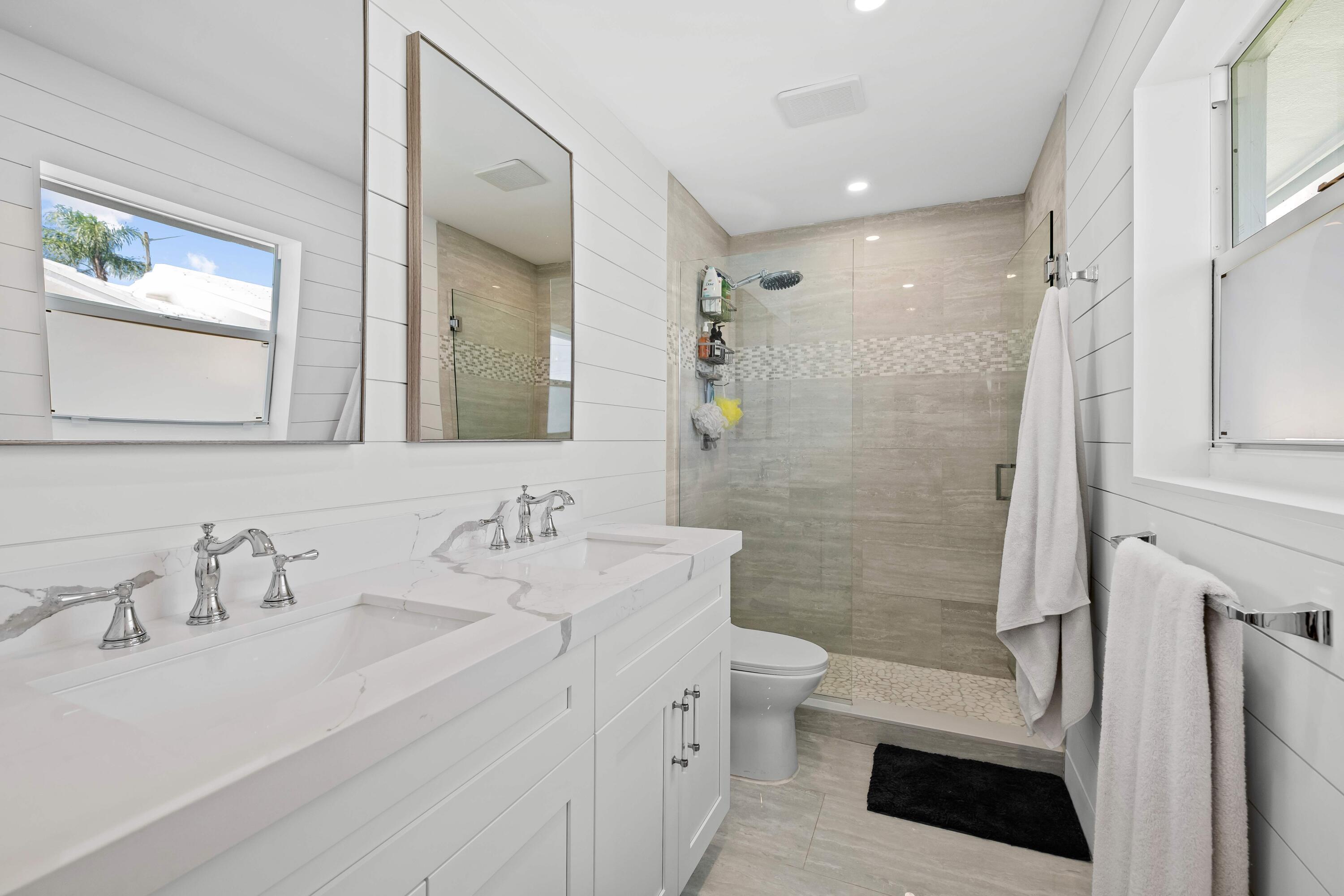 698 West Camino Boca Raton, FL 33486 - Photo 15 of 30 a bathroom with a sink a toilet and shower