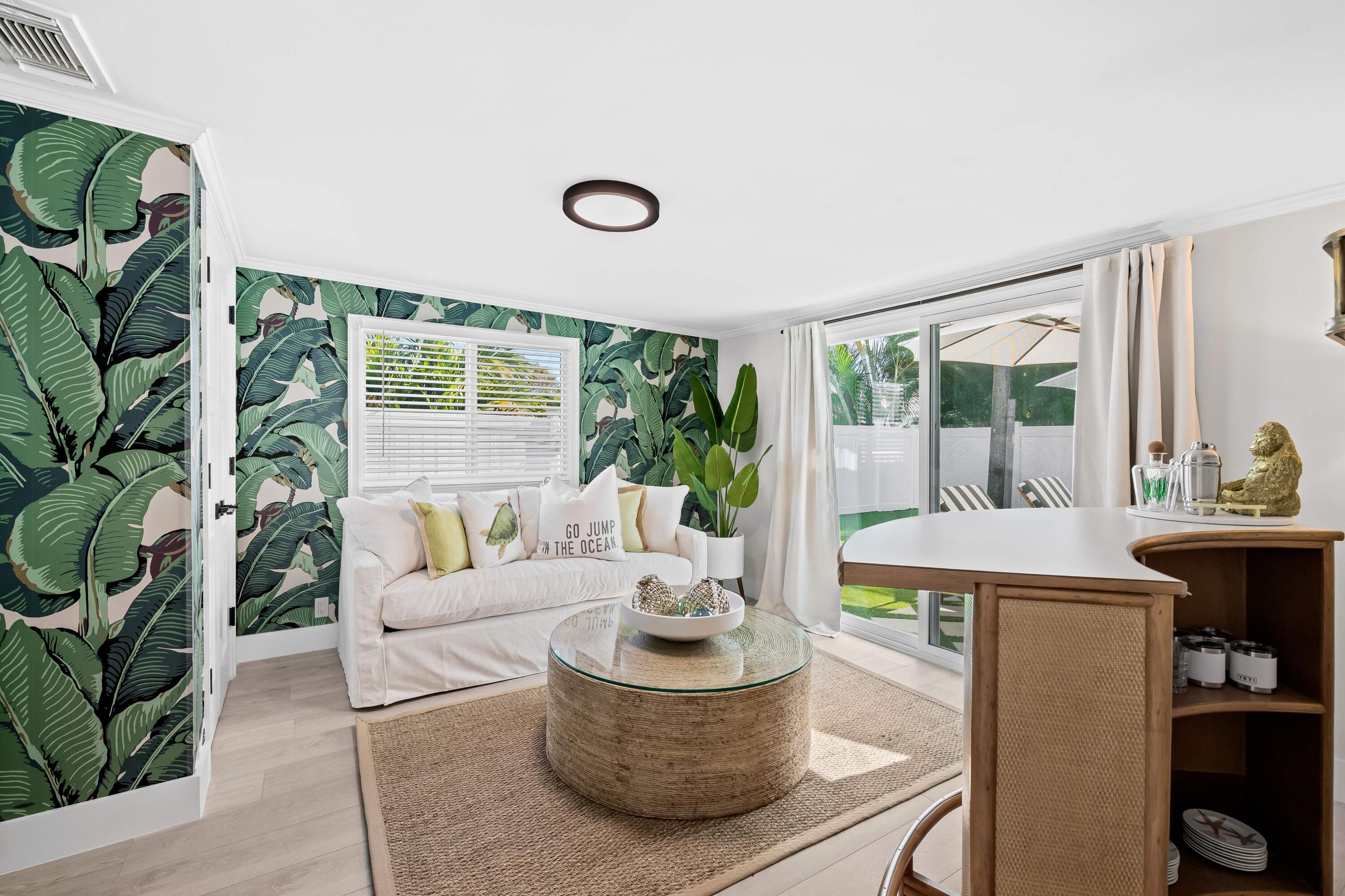 698 West Camino Boca Raton, FL 33486 - Photo 16 of 30 a living room with furniture and a large window