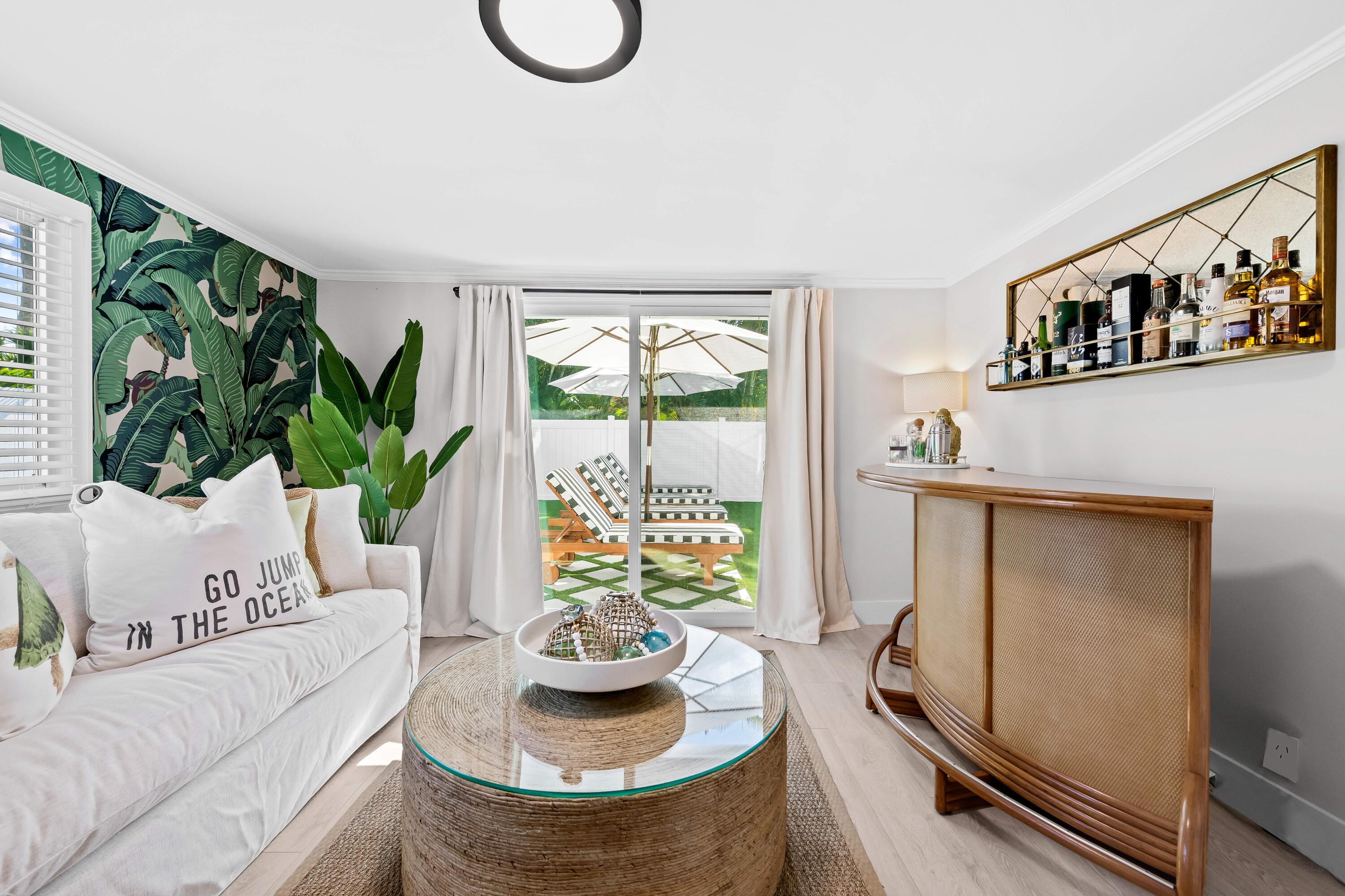 698 West Camino Boca Raton, FL 33486 - Photo 24 of 30 a living room with furniture and a potted plant