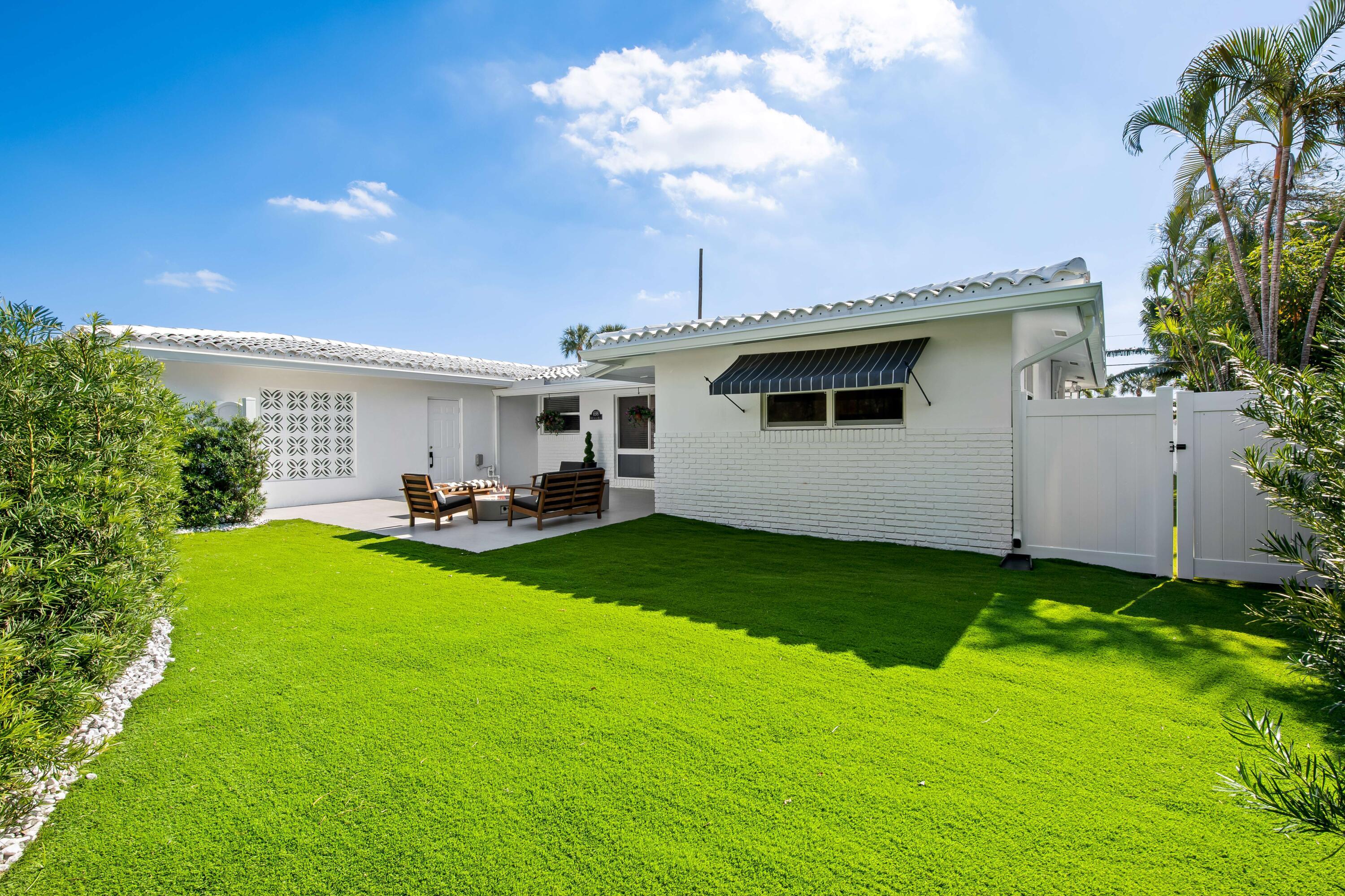 698 West Camino Boca Raton, FL 33486 - Photo 29 of 30 a view of a backyard with plants and a patio