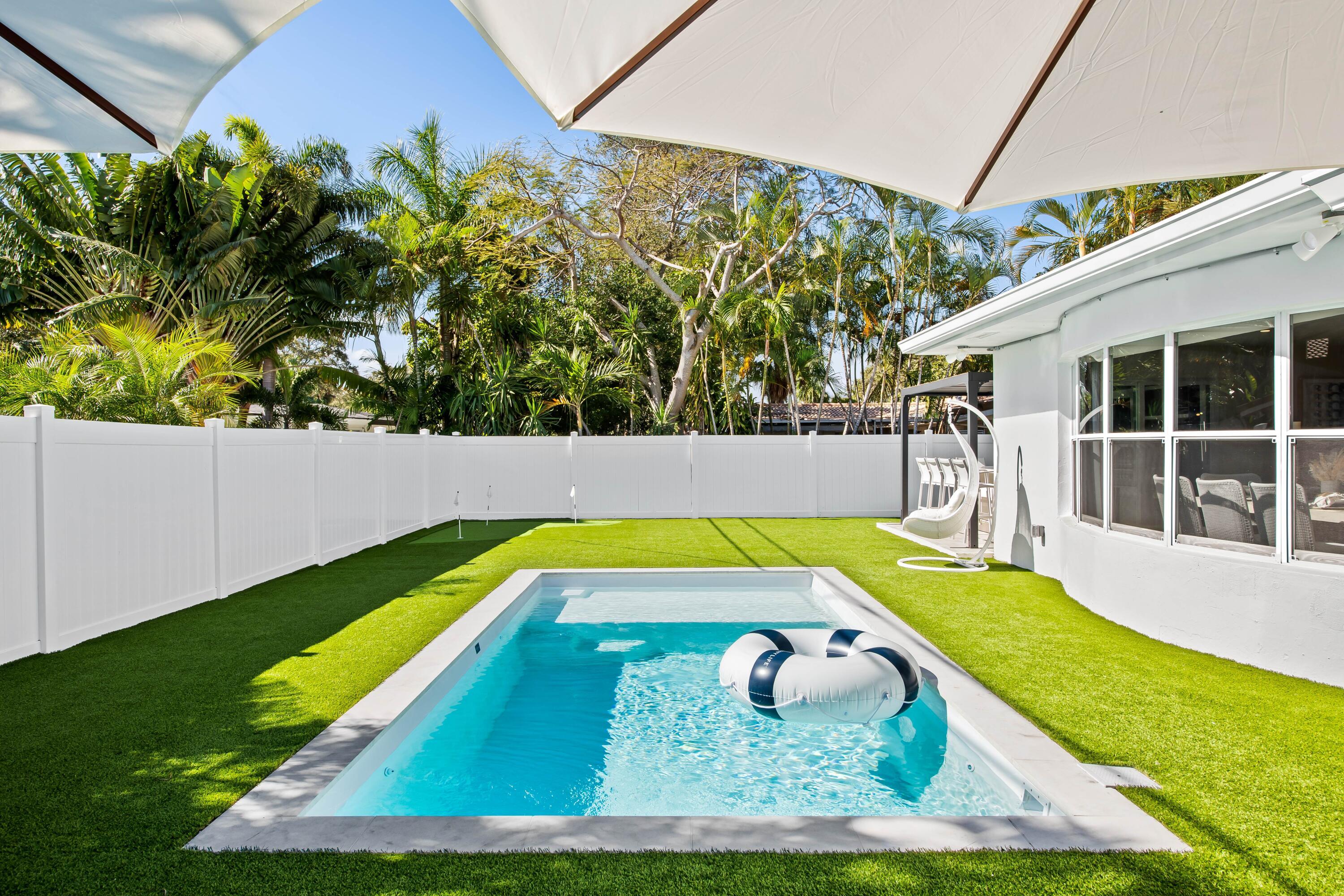 698 West Camino Boca Raton, FL 33486 - Photo 4 of 30 a view of a backyard with swimming pool