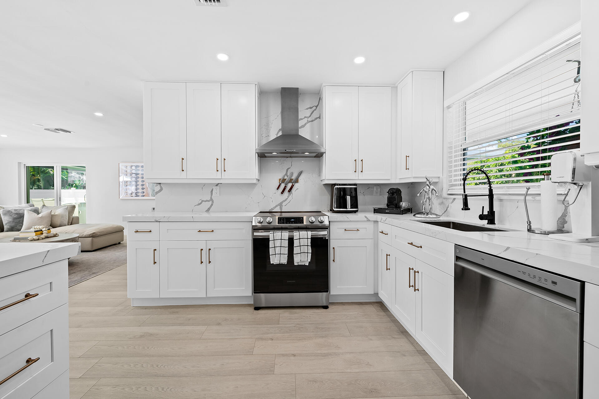 698 West Camino Boca Raton, FL 33486 - Photo 7 of 30 a kitchen with stainless steel appliances granite countertop a stove sink and cabinets
