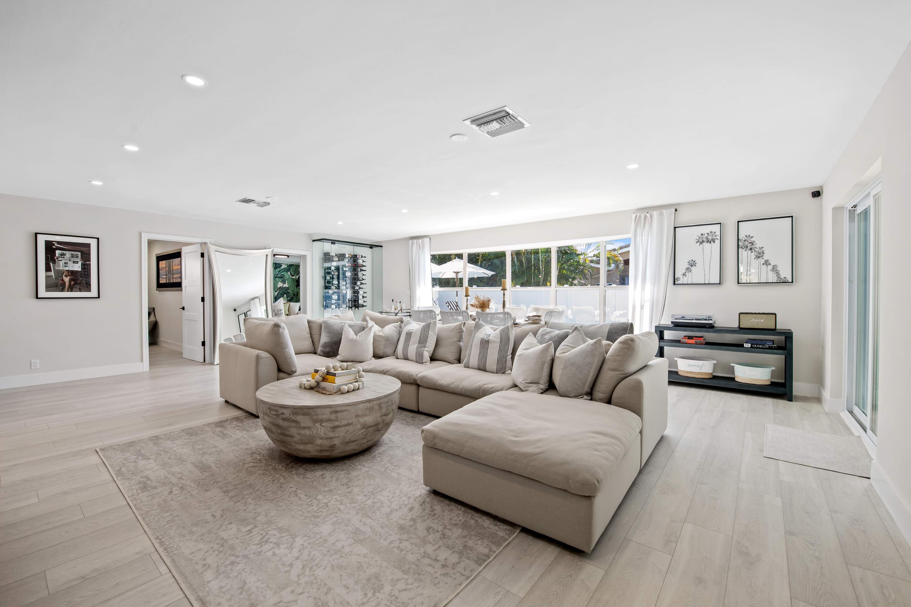 698 West Camino Boca Raton, FL 33486 - Photo 10 of 30 a living room with furniture and a wooden floor