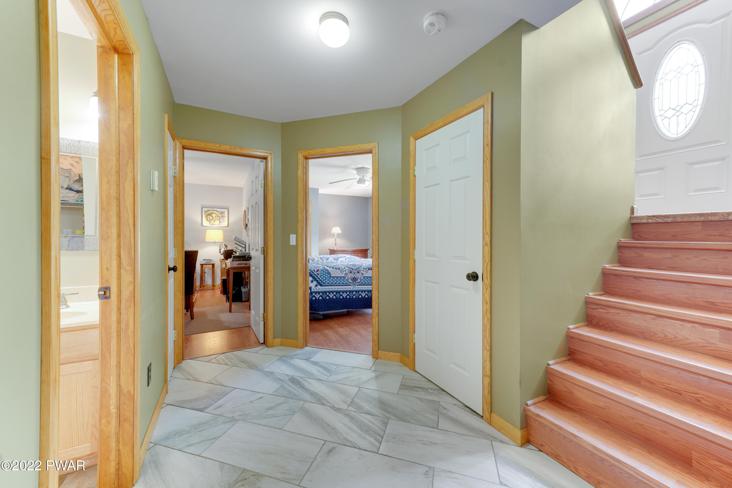 114 Lancaster Road Milford, PA 18337 - Photo 32 of 42 a view of a hallway with wooden floor and a bathroom