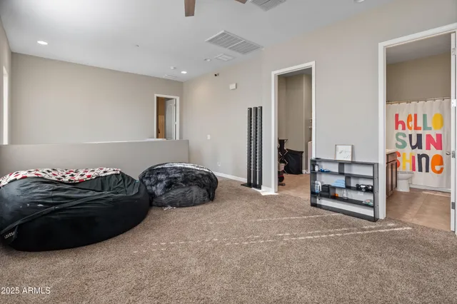 a bedroom with a bed and a couch