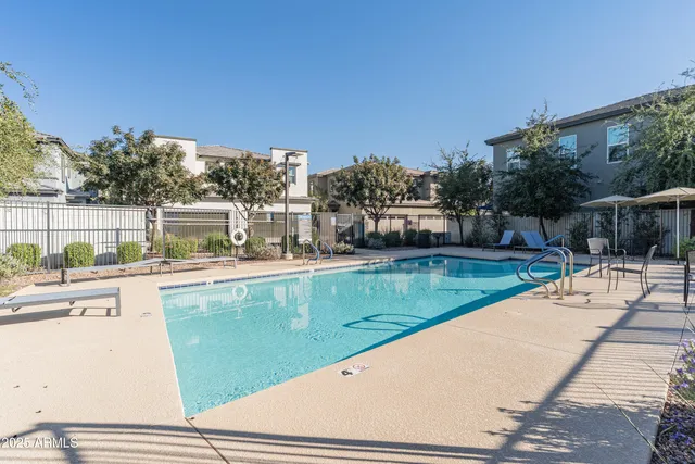 a view of swimming pool with a yard