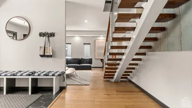 a bedroom with two beds and a large window